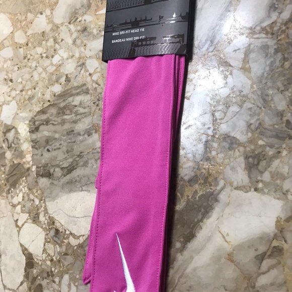 Nike new head tie with white swoosh on it. - Picture 5 of 6